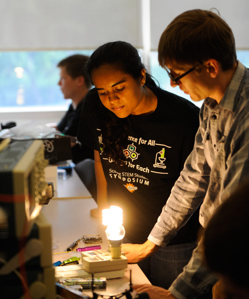 Erik Schettig, right, works with high school student Chitra Srinivasan in FREEDM’s Young Scholars program. Photo by Marc Hall.